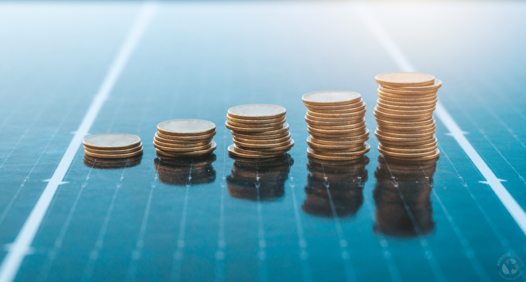 Stacks of coins placed on a solar panel surface representing solar battery costs and savings