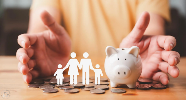 Hands protecting a family cutout and piggy bank, representing government rebates and financial incentives for home battery investment. 